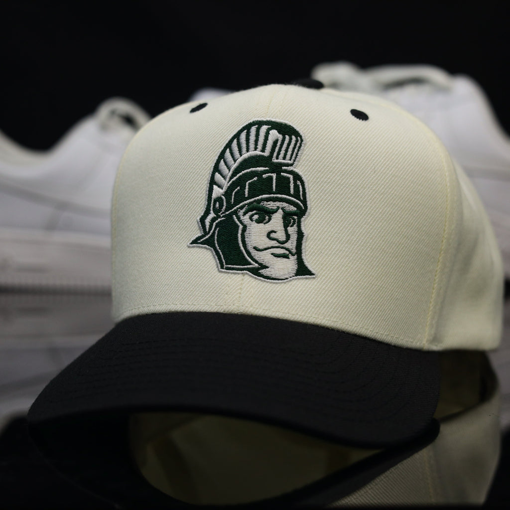 MICH. ST. SPARTAN$ CRM/BLK (Green UV)